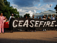 People attend a 'Mourner's Kaddish for Rafah' demonstration in front of the White House in Washington, D.C. on May 30, 2024. The action was...