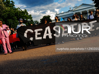 People attend a 'Mourner's Kaddish for Rafah' demonstration in front of the White House in Washington, D.C. on May 30, 2024. The action was...