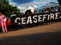 People attend a 'Mourner's Kaddish for Rafah' demonstration in front of the White House in Washington, D.C. on May 30, 2024. The action was...