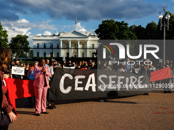 People attend a 'Mourner's Kaddish for Rafah' demonstration in front of the White House in Washington, D.C. on May 30, 2024. The action was...