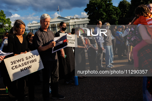 People attend a 'Mourner's Kaddish for Rafah' demonstration in front of the White House in Washington, D.C. on May 30, 2024. The action was...