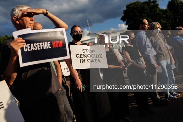 People attend a 'Mourner's Kaddish for Rafah' demonstration in front of the White House in Washington, D.C. on May 30, 2024. The action was...