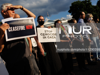 People attend a 'Mourner's Kaddish for Rafah' demonstration in front of the White House in Washington, D.C. on May 30, 2024. The action was...