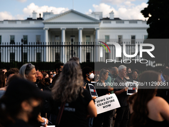 People attend a 'Mourner's Kaddish for Rafah' demonstration in front of the White House in Washington, D.C. on May 30, 2024. The action was...