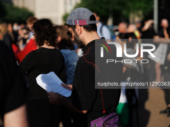 A person reads a prayer at a 'Mourner's Kaddish for Rafah' demonstration in front of the White House in Washington, D.C. on May 30, 2024. Th...