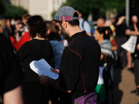 A person reads a prayer at a 'Mourner's Kaddish for Rafah' demonstration in front of the White House in Washington, D.C. on May 30, 2024. Th...