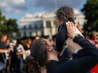 A woman holds a child at a 'Mourner's Kaddish for Rafah' demonstration in front of the White House in Washington, D.C. on May 30, 2024. The...