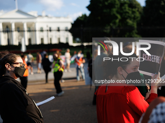 People attend a 'Mourner's Kaddish for Rafah' demonstration in front of the White House in Washington, D.C. on May 30, 2024. The action was...