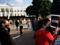 People attend a 'Mourner's Kaddish for Rafah' demonstration in front of the White House in Washington, D.C. on May 30, 2024. The action was...