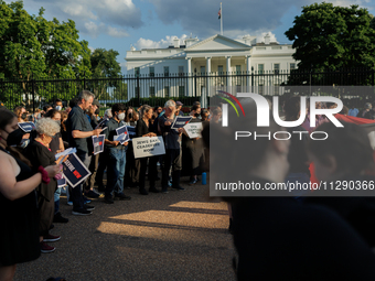 People attend a 'Mourner's Kaddish for Rafah' demonstration in front of the White House in Washington, D.C. on May 30, 2024. The action was...