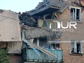 A block of flats is being damaged by the overnight Russian missile attack in the Novobavarskyi district of Kharkiv, northeastern Ukraine, on...