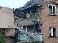 A block of flats is being damaged by the overnight Russian missile attack in the Novobavarskyi district of Kharkiv, northeastern Ukraine, on...