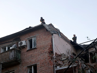 Rescuers are removing the rubble at a block of flats damaged by the overnight Russian missile attack in the Novobavarskyi district of Kharki...