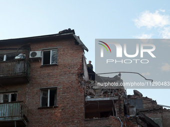 Rescuers are removing the rubble at a block of flats damaged by the overnight Russian missile attack in the Novobavarskyi district of Kharki...