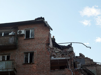 Rescuers are removing the rubble at a block of flats damaged by the overnight Russian missile attack in the Novobavarskyi district of Kharki...