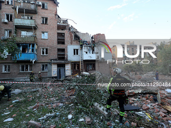 Rescuers are removing the rubble at a block of flats damaged by the overnight Russian missile attack in the Novobavarskyi district of Kharki...