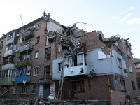 Rescuers are removing the rubble at a block of flats damaged by the overnight Russian missile attack in the Novobavarskyi district of Kharki...