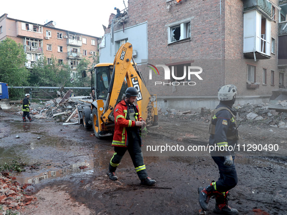 Rescuers are removing the rubble at a block of flats damaged by the overnight Russian missile attack in the Novobavarskyi district of Kharki...