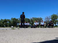 Border police are explaining the types of drones in Altay, Xinjiang province, China, on May 31, 2024. (