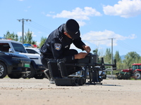 A border police officer is explaining the precautions during a drone flight in Altay, Xinjiang province, China, on May 31, 2024. (