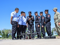 A border police officer is explaining the precautions during a drone flight in Altay, Xinjiang province, China, on May 31, 2024. (