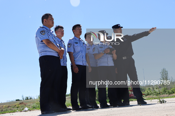 Border police officers are flying independently under the guidance of instructors in Altay, Xinjiang province, China, on May 31, 2024. 