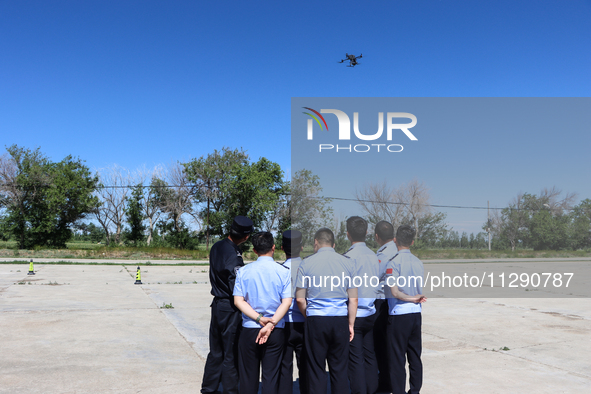 Border police officers are flying independently under the guidance of instructors in Altay, Xinjiang province, China, on May 31, 2024. 