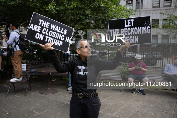 People are rejoicing across the street from Manhattan Criminal Court in New York, on May 30, 2024, moments after a jury finds former U.S. pr...