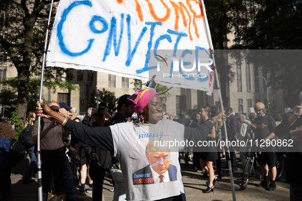 People are rejoicing across the street from Manhattan Criminal Court in New York, on May 30, 2024, moments after a jury finds former U.S. pr...