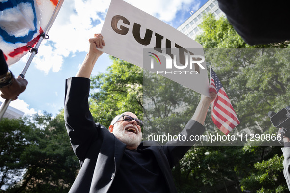 People are rejoicing across the street from Manhattan Criminal Court in New York, on May 30, 2024, moments after a jury finds former U.S. pr...