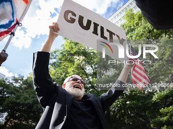 People are rejoicing across the street from Manhattan Criminal Court in New York, on May 30, 2024, moments after a jury finds former U.S. pr...