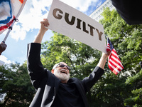 People are rejoicing across the street from Manhattan Criminal Court in New York, on May 30, 2024, moments after a jury finds former U.S. pr...