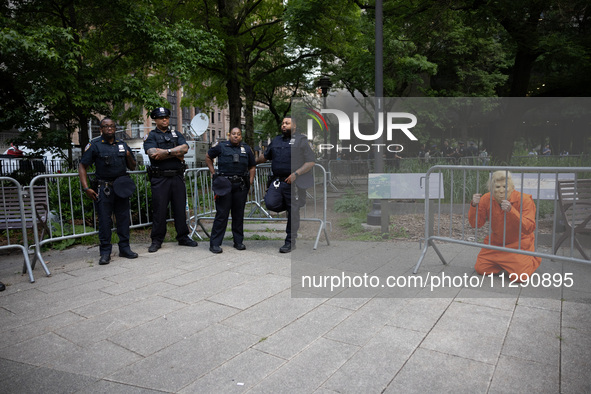 People are gathering across the street from Manhattan Criminal Court in New York, United States, on May 30, 2024, moments after a jury finds...