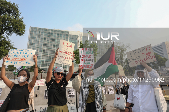 Indonesian Pro-Palestine Muslims are holding a rally in front of the US Embassy in Jakarta, Indonesia, on May 31, 2024.  