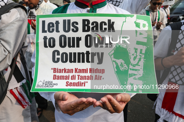 Indonesian Pro-Palestine Muslims are holding a rally in front of the US Embassy in Jakarta, Indonesia, on May 31, 2024.  