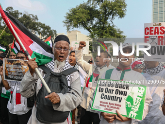 Indonesian Pro-Palestine Muslims are holding a rally in front of the US Embassy in Jakarta, Indonesia, on May 31, 2024.  (