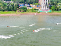 An emergency team is participating in an emergency rescue drill during the 2024 flood control and geological disaster comprehensive emergenc...