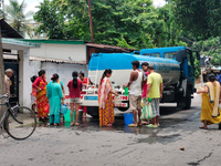 Residents are queuing up to collect drinking water from the drinking water tank in Siliguri, India, on May 31, 2024. The entire area, includ...