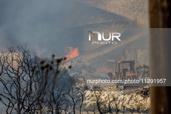 Flames are being seen inside a private property area in Limassol, Cyprus, on May 31, 2024. Some buildings are being endangered after a fire...