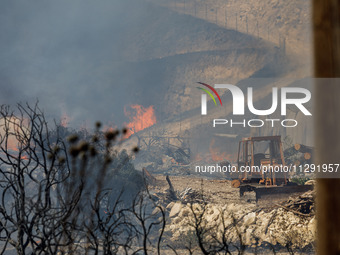 Flames are being seen inside a private property area in Limassol, Cyprus, on May 31, 2024. Some buildings are being endangered after a fire...