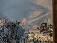 Flames are being seen inside a private property area in Limassol, Cyprus, on May 31, 2024. Some buildings are being endangered after a fire...