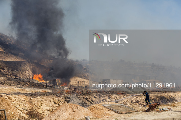 Flames are being seen inside a private property area in Limassol, Cyprus, on May 31, 2024. Some buildings are being endangered after a fire...