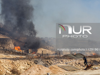 Flames are being seen inside a private property area in Limassol, Cyprus, on May 31, 2024. Some buildings are being endangered after a fire...