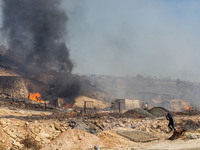 Flames are being seen inside a private property area in Limassol, Cyprus, on May 31, 2024. Some buildings are being endangered after a fire...