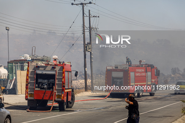 Firemen are being seen in the area in Limassol, Cyprus, on May 31, 2024. Some buildings are being in danger after a fire is breaking out in...