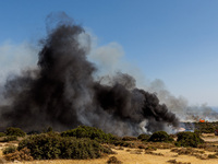 Thick smoke is being seen in the area in Limassol, Cyprus, on May 31, 2024. Some buildings are being in danger after a fire is breaking out...