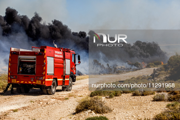 Firemen are preparing to fight the flames in Limassol, Cyprus, on May 31, 2024. Some buildings are in danger after a fire breaks out in the...