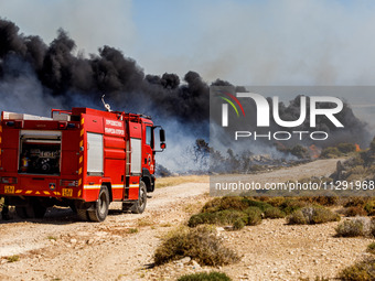 Firemen are preparing to fight the flames in Limassol, Cyprus, on May 31, 2024. Some buildings are in danger after a fire breaks out in the...