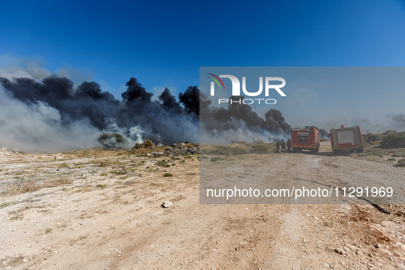 Firemen are preparing to fight the flames in Limassol, Cyprus, on May 31, 2024. Some buildings are in danger after a fire breaks out in the...