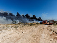 Firemen are preparing to fight the flames in Limassol, Cyprus, on May 31, 2024. Some buildings are in danger after a fire breaks out in the...